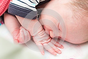 Newborn 8 days old baby sleeping in the crib