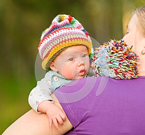 Newborn baby in the arms of mom