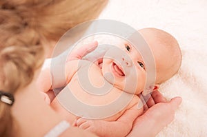 Newborn baby in the arms of mother