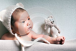 Newborn baby asian boy sleeping at blue background