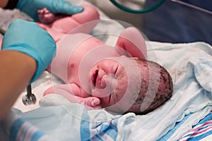 Newborn baby being examined