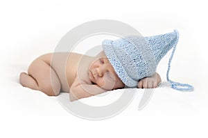 Newborn baby in a blue cap