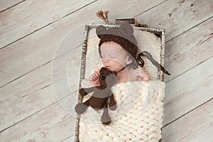 Newborn Baby Boy with Bear Hat and Stuffed Bear Toy