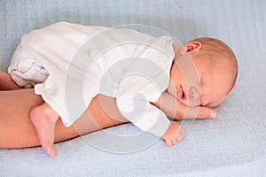 Newborn baby boy on a blue blanket