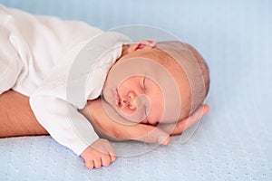 Newborn baby boy on a blue blanket