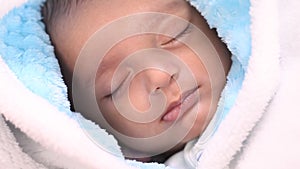 Newborn baby boy crying in deep sleep