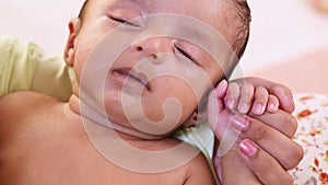 Newborn baby boy crying in deep sleep