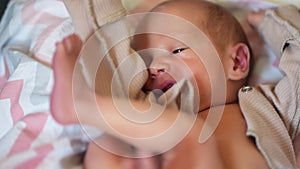 newborn baby. boy infant lies in a child bed. happy family birthday closeup baby concept