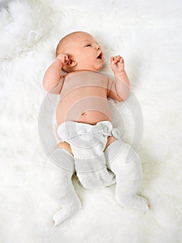 Newborn Baby Boy With Legs Wrapped In Bandage