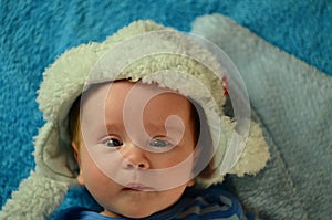 newborn baby boy 3 months old. in a funny winter hat - portrait