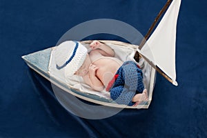 Newborn Baby Boy Sailor Sleeping in a Boat