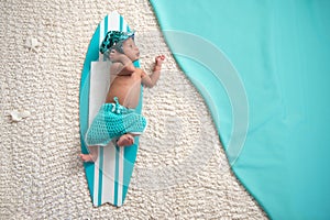 Newborn Baby Boy on Surfboard