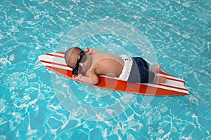 Newborn Baby Boy on Surfboard