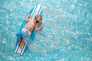 Newborn Baby Boy on Surfboard