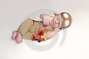Newborn Baby Boy Wearing an Aviator Outfit