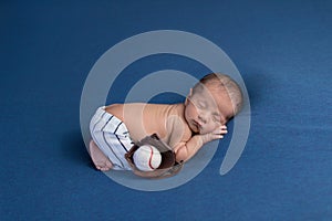 Newborn Baby Boy Wearing Baseball Uniform