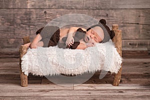 Newborn Baby Boy Wearing a Bear Bonnet