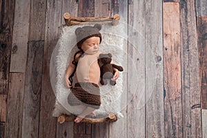 Newborn Baby Boy Wearing a Bear Bonnet