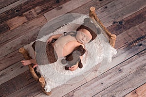 Newborn Baby Boy Wearing a Bear Bonnet