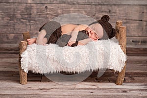 Newborn Baby Boy Wearing a Bear Bonnet