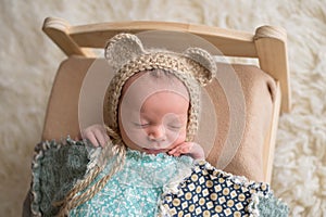 Newborn Baby Boy Wearing a Bear Bonnet