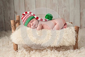 Newborn Baby Boy Wearing a Christmas Elf Hat