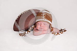 Newborn Baby Boy Wearing a Crocheted Football Hat