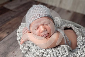Newborn Baby Boy Wearing a Mohair Bonnet