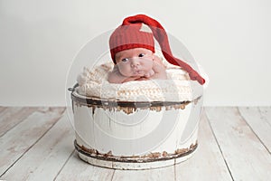 Newborn Baby Boy Wearing a Red Stocking Cap