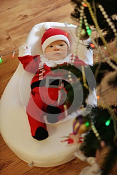 Newborn baby boy wearing Santa clothes