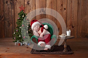 Newborn Baby Boy Wearing a Santa Suit