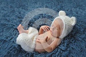 Newborn Baby Boy Wearing a White Bear Costume