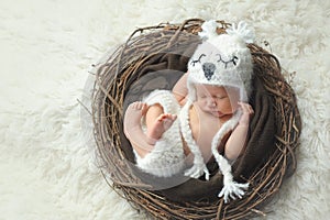 Newborn Baby Boy Wearing a White Owl Hat