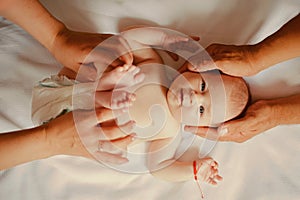 Newborn baby care. Pediatric care of newborn. Little baby given massage at pediatrist. Pediatrics and neonatology