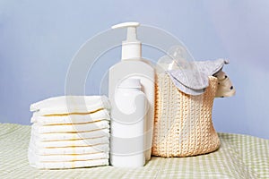 Newborn baby care supplies on changing table.