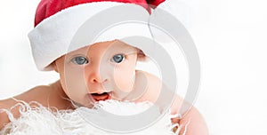 Newborn baby in a Christmas hat