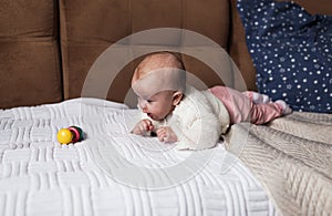 a newborn baby in a crib, the concept of children and the birth of a close-up