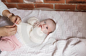 a newborn baby in a crib, the concept of children and the birth of a close-up