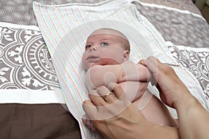 Newborn baby doing exercise