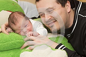 Newborn baby and father