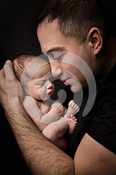 Newborn Baby and Father Portrait, Man holding New Born Kid on Hands, Parents Care photo