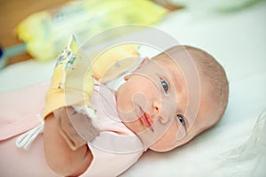 A newborn baby on the first day of its birth in the maternity hospital