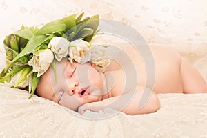 Newborn baby with flowers