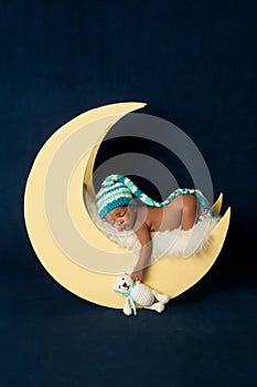 Newborn Baby Girl Sleeping on the Moon