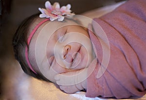 Newborn baby girl smiling