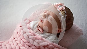 Newborn Baby Girl Sweetly Sleeping Covered Pink Knitted Blanket
