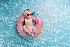 Newborn Baby Girl Wearing a Bikini and Sunglasses