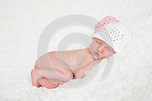 Newborn Baby Girl Wearing a Crocheted Hat