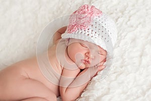 Newborn Baby Girl Wearing a Crocheted Hat