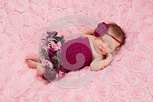 Newborn Baby Girl Wearing a Crocheted Romper photo